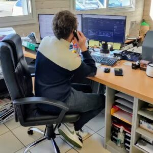 Salesman in his office on the phone